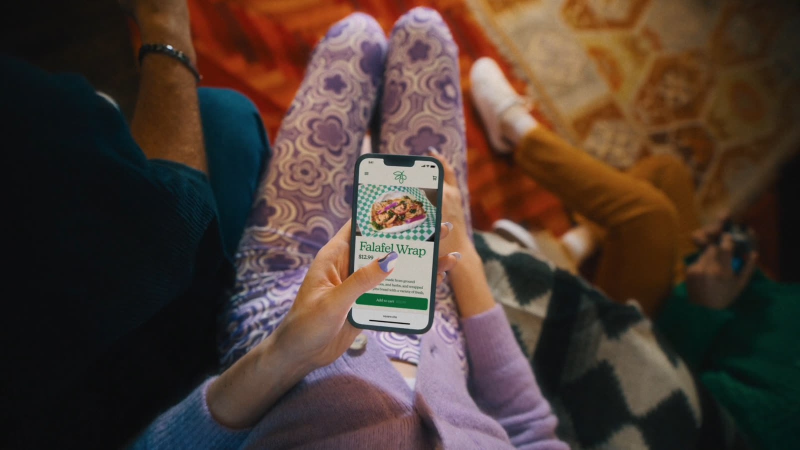 POV down at own legs, phone in hand